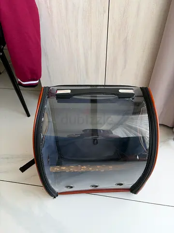 Transparent parrot backpack carrier