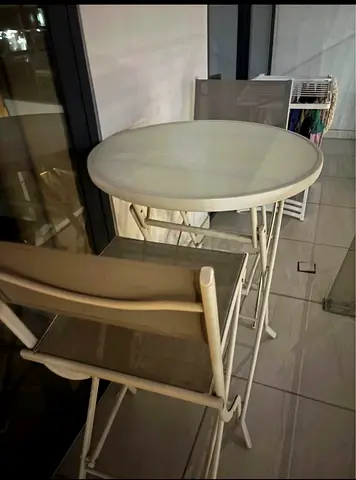 Compact white bistro table with two matching folding chairs - good condition BALCONY