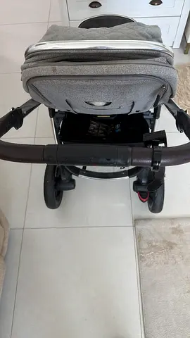Light grey compact baby stroller in good condition