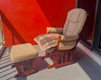Gliding chair with ottoman foot rest