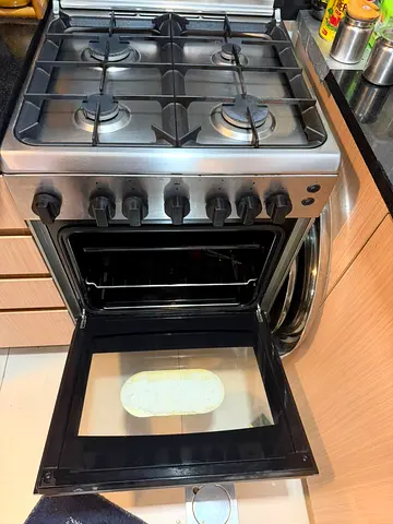 Used 4-Burner Stainless Steel Gas Cooker with Oven - Good Working Condition