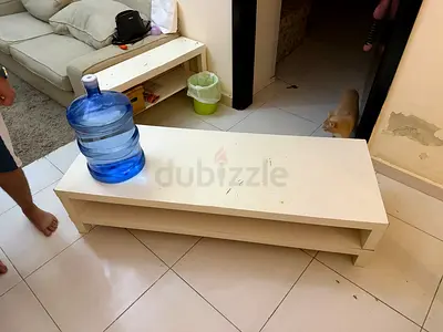 Low white wooden coffee table with shelf - used