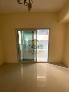 Apartment in Al Taawun, no commission, one bedroom, living room, bathroom, balcony, side view