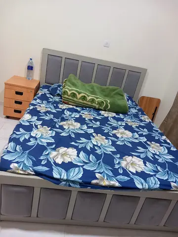 Queen bed frame with mattress and bedside table - good condition