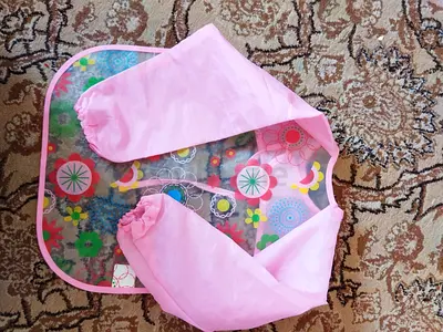 Used long-sleeve waterproof baby feeding/smock bib - pink