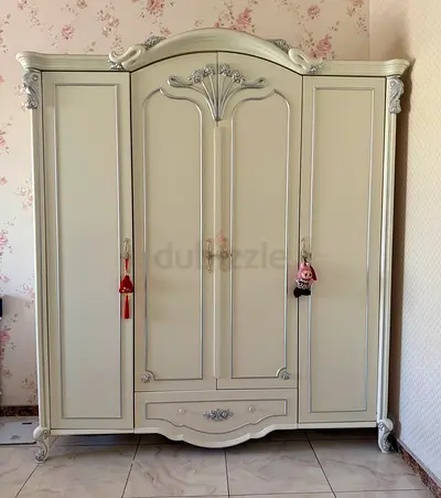 Cream vintage-style 4-door wardrobe with carved details - good condition