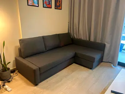 Dark grey L-shaped sofa bed perfect condition