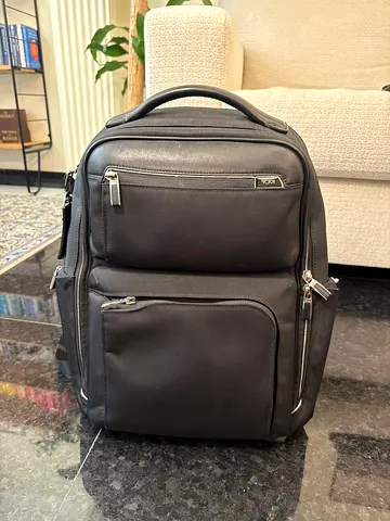 Used Tumi Black Travel Backpack with Multiple Front Pockets