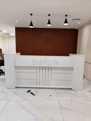 White Reception Desk with Gold Accents