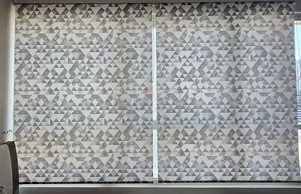 Pair of geometric fabric roller blinds — good condition