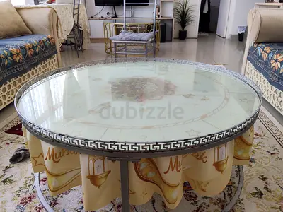 Round Glass Top Coffee Table with Decorative Metal Trim