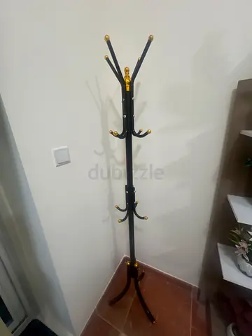 Black metal standing coat rack with gold accents - good condition