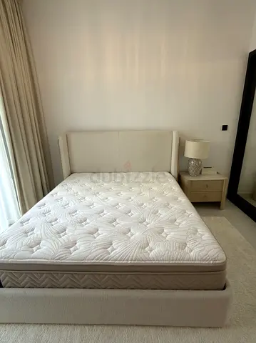 King upholstered bed frame with mattress and bedside table - light beige
