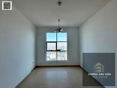 City Tower 1BR apartment with master bedroom, spacious hall, equipped kitchen, open-view balcony, sunny layout, prime location, easy Dubai access.