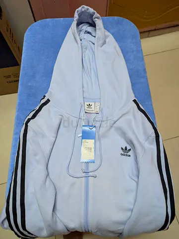 Adidas Originals Woman Trefoil zip hoodie in a light blue color