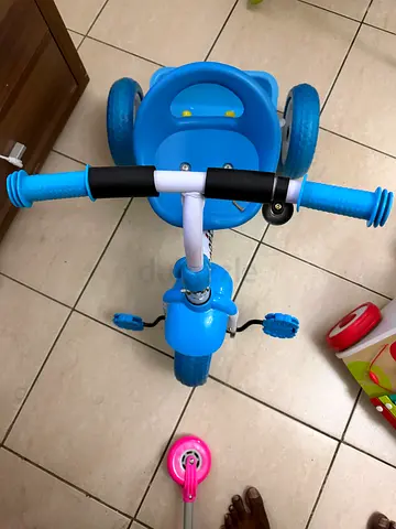 Blue toddler tricycle with removable pedals - good condition