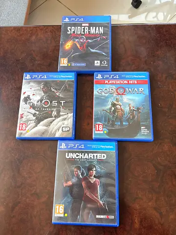 Set of 4 PS4 Games — Ghost of Tsushima, Spider-Man Miles Morales, $% of War  Uncharted