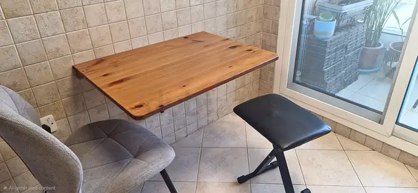 Wall-mounted wooden fold-down table — compact breakfast/desk