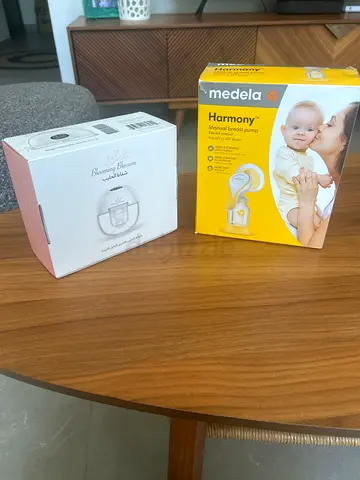 Medela Harmony breast pump + gift boxed electric breast pump (new in boxes)