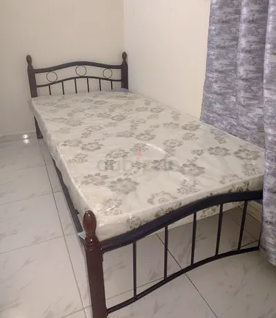 Single metal bed frame with mattress