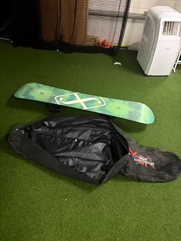 Flow snowboard with bindings and travel bag