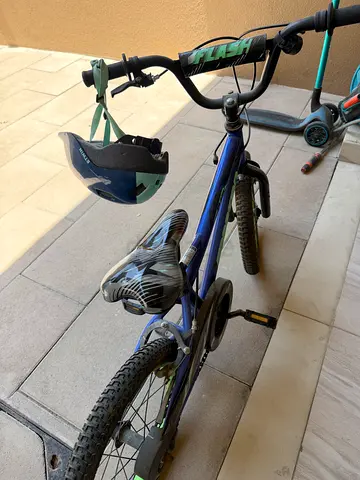 Childs blue training-wheel bike
