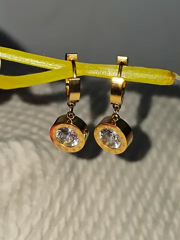 Gold-tone drop earrings with clear round stones — gently used