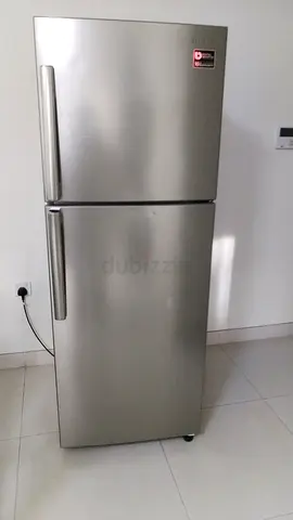 Silver double-door refrigerator, good working condition