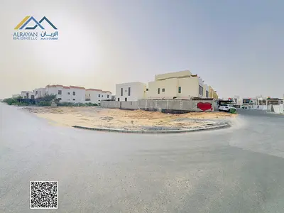 Two corner plots, including registration and ownership fees, with a wide setback in front of the land.