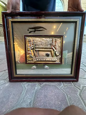 Framed embossed metal relief of traditional Middle Eastern scene