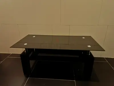 Black glass coffee table with lower shelf - good condition