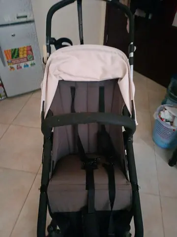 Lightweight beige baby stroller in good condition