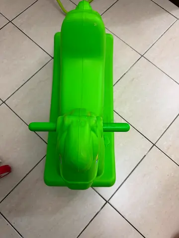 Green plastic toddler ride-on rocker toy (good condition)