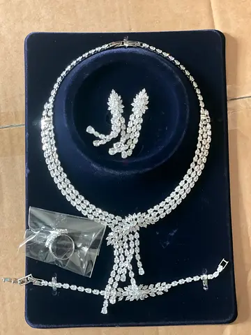 Silver-tone crystal necklace set with matching earrings and bracelet (unused ring included)