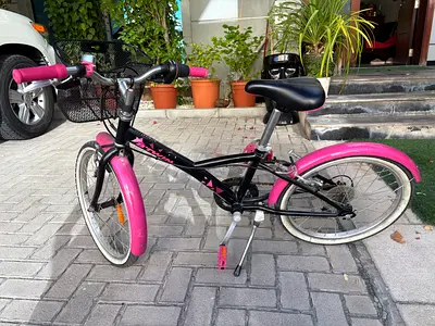 Btwin Kids black and pink 16-inch bike with mudguards