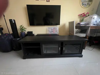 Black wooden TV entertainment unit with glass doors - sturdy lowboard