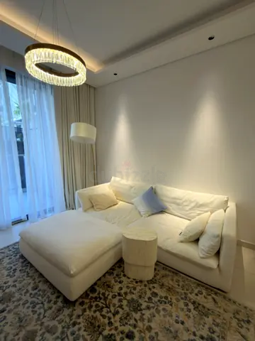 White L-shaped Sofa with Ottoman — Comfortable, Minimal Design
