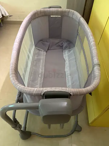 Chargeable Light grey bedside bassinet / cradle in good condition