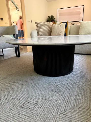 Round Black Ribbed Coffee Table with White Marble Top