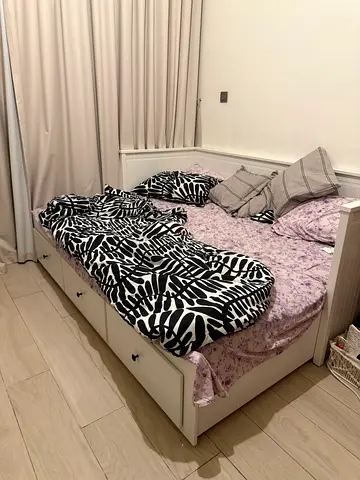 Sofa cum bed with built-in storage drawers — white wooden frame and two mattress