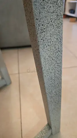 Customized ikea stool chairs used for dining table with stone effect and washable covers.
