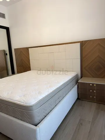 King size upholstered bed frame with mattress and matching bedside table