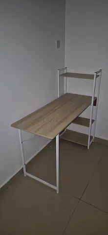 Slim study desk with built-in shelving — light wood and white frame