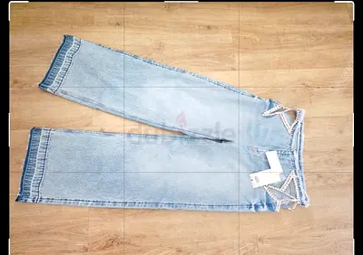 Limited Edition Stella Maccartney x HM Light wash wide-leg womens jeans with sequin star detail