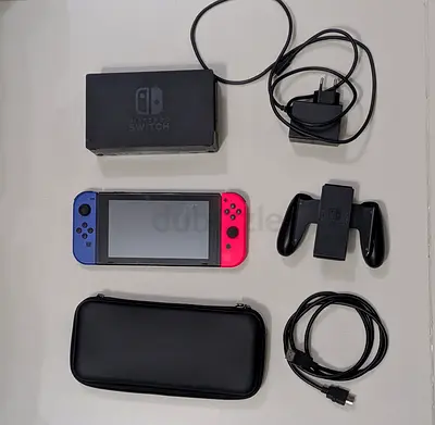 Nintendo Switch console (Neon Joy-Con) with dock, charger, grip and case
