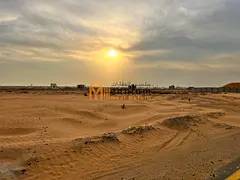 For sale: land in Al Sahmah on a 97-meter road.