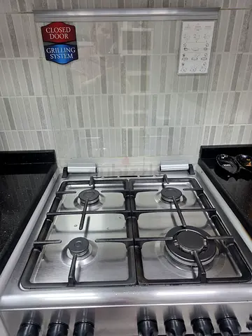 Candy, Stainless Steel 4-Burner Gas Stove with Griddle - Good Condition