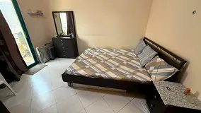 1Bedroom with attached balcony in 1BHK apartment. Sharing kitchen and bathroom with 1 tenant.