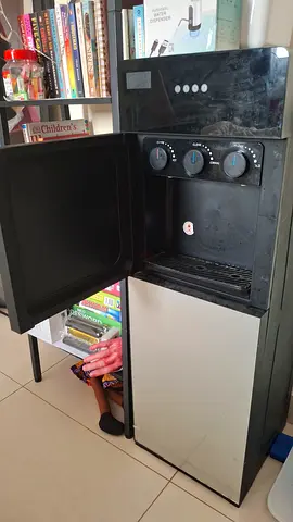 Used freestanding water dispenser with hot, cold and room temp taps