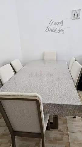 Dining table with 6 upholstered chairs - good condition - original price is 8000